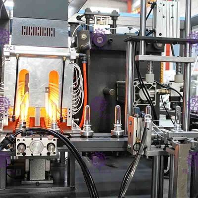 जूस प्रोसेसिंग लाइन के लिए दो कैविटी 0.1-2L पीईटी बोतल ब्लोइंग मशीन